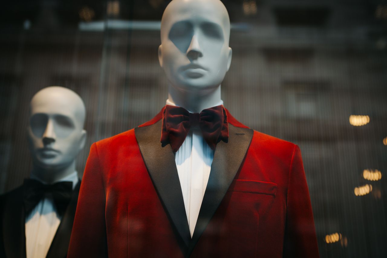 services-03 Stylish red tuxedo jackets showcased on mannequins, reflecting modern fashion.